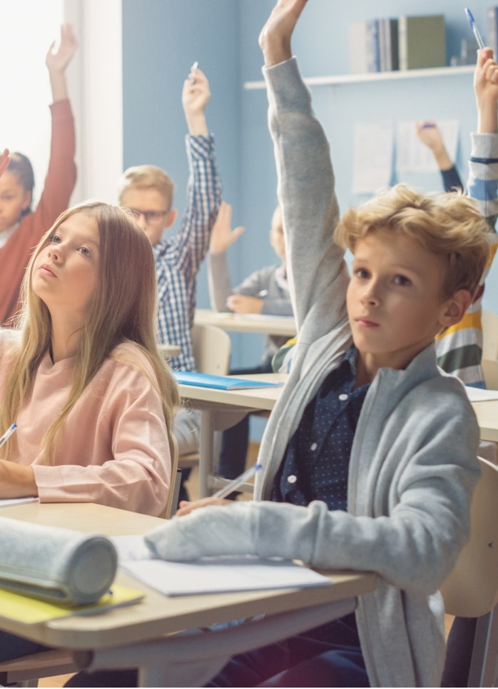 Children answering in the classroom